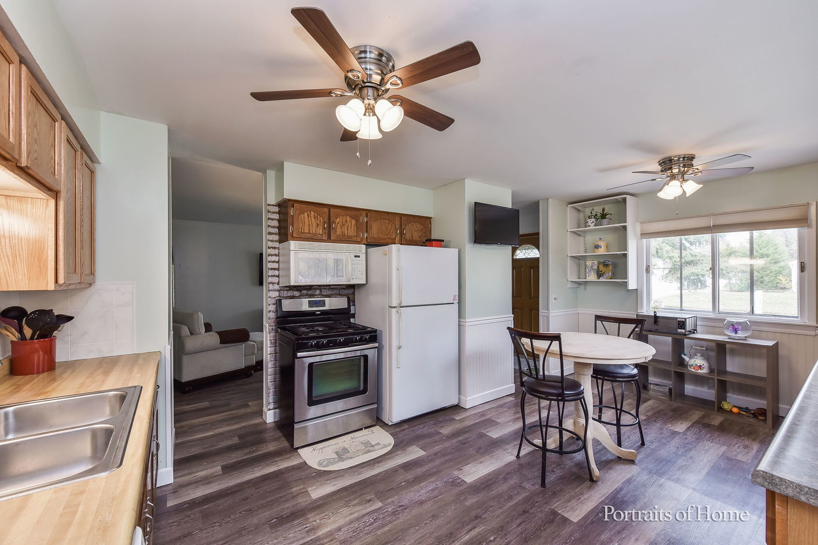 78 Saugatuck Road Montgomery, IL 60538 - Photo 11 of 21 a view of a dining room with furniture window and wooden floor