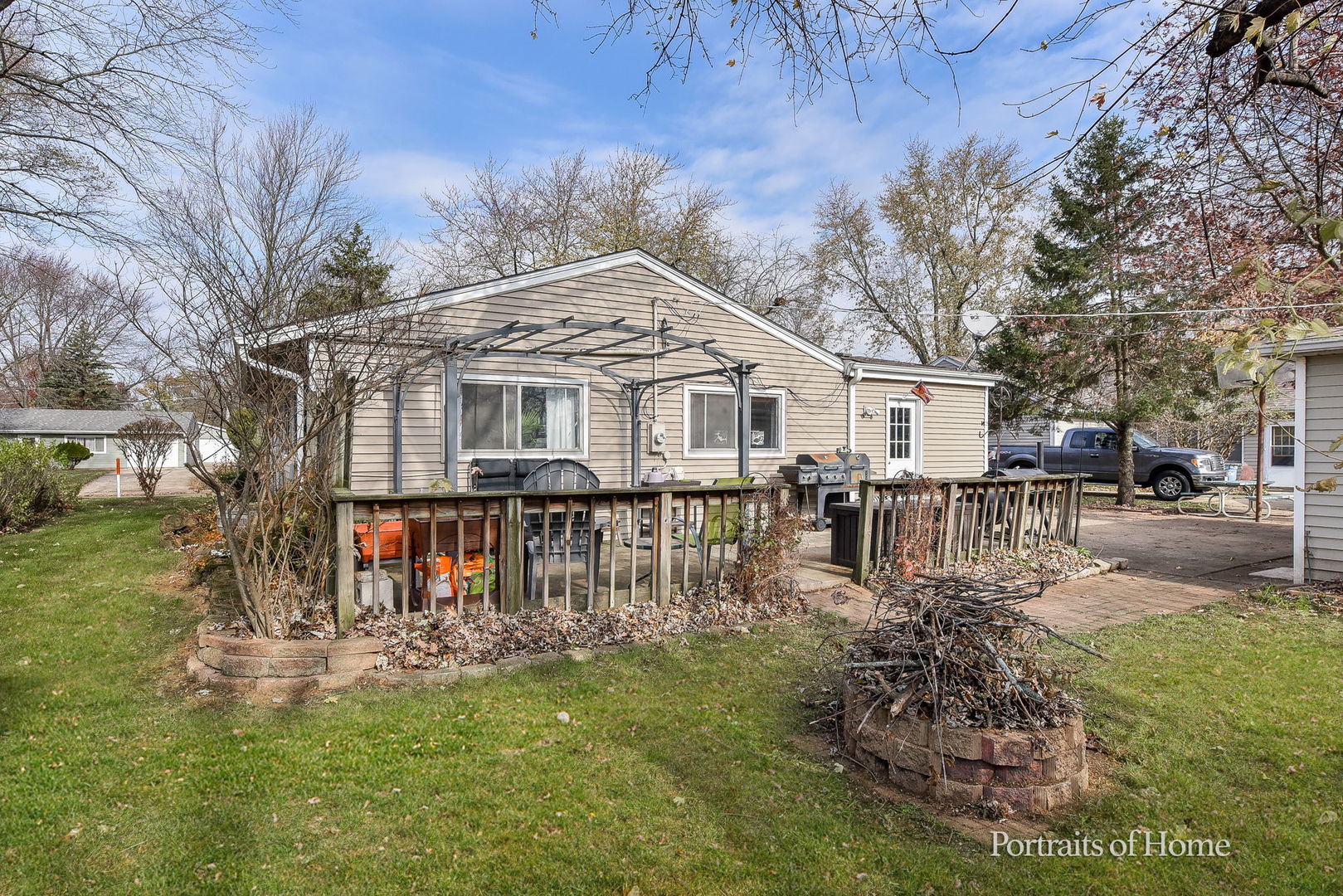 78 Saugatuck Road Montgomery, IL 60538 - Photo 19 of 21 a front view of a house with a yard table and chairs