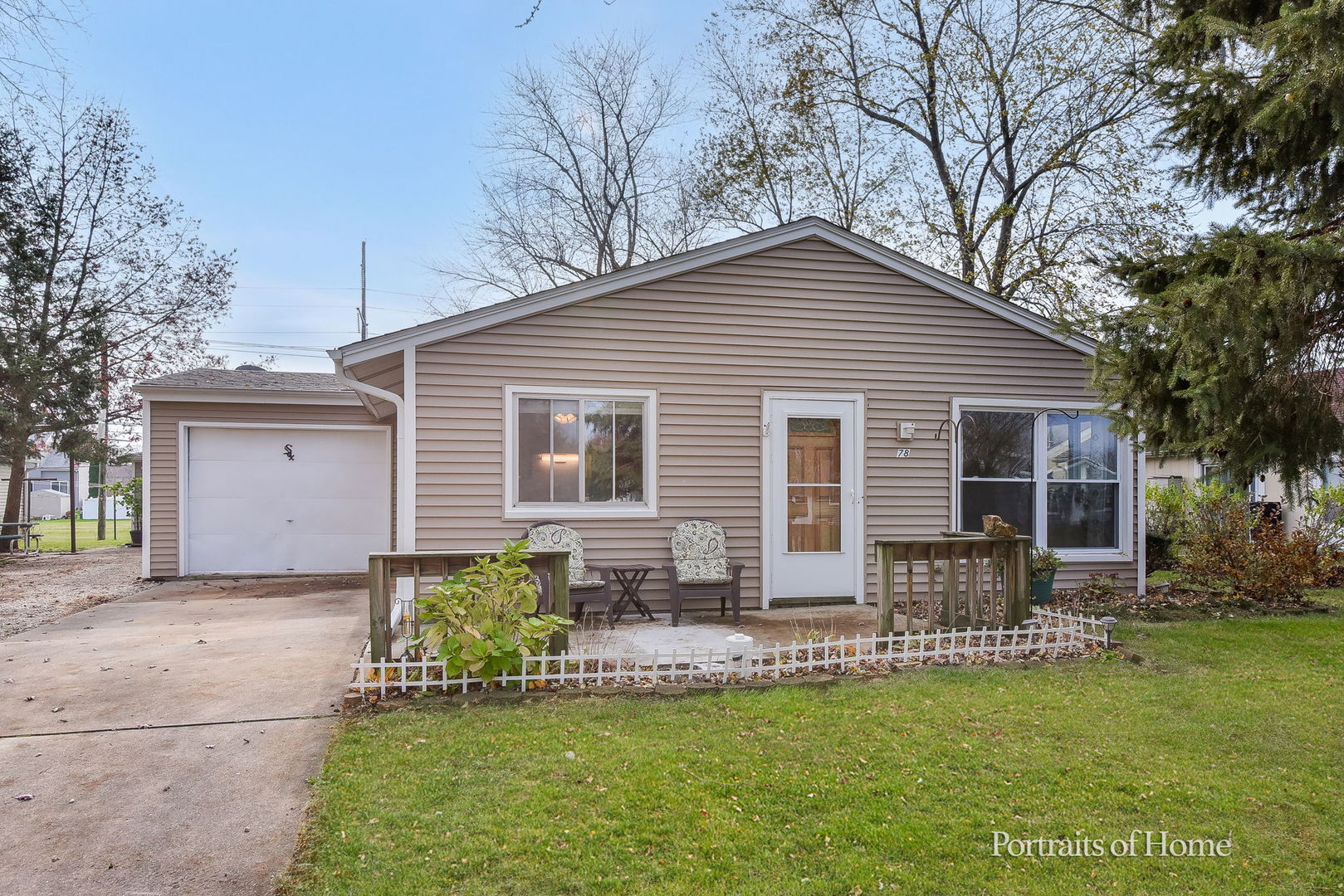 78 Saugatuck Road Montgomery, IL 60538 - Photo 2 of 21 a front view of house with a garden and patio