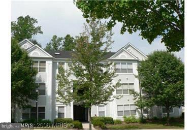 14101 Fall Acre Court, Unit 422 Silver Spring, MD 20906 - Photo 1 of 1 a front view of a residential houses with yard and green space
