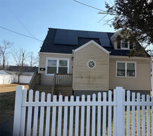 a front view of a house with glass windows