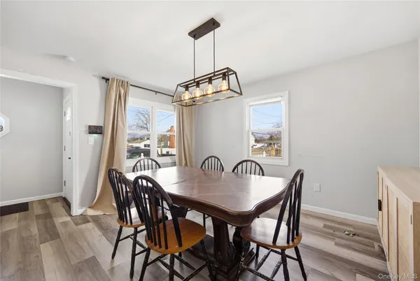 a dining room with furniture and window
