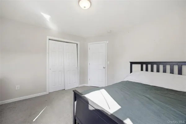 a bedroom with a bed and a table