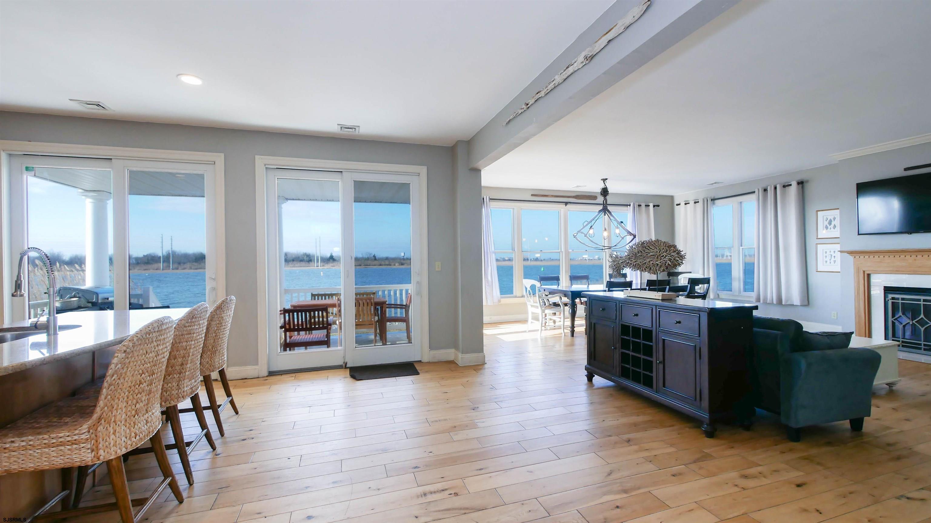 2070 West Riverside Drive Atlantic City, NJ 08401 - Photo 6 of 40 a living room with furniture a large window and a fireplace