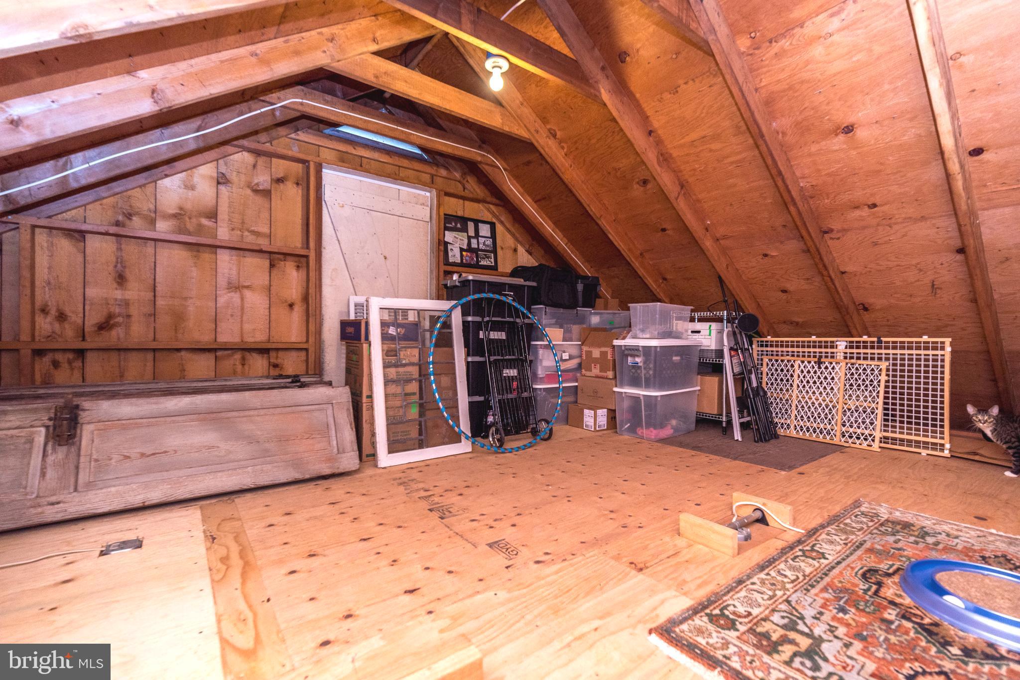 114 Headquarters Road Erwinna, PA 18920 - Photo 21 of 39 Attic above the sunroom with barn door