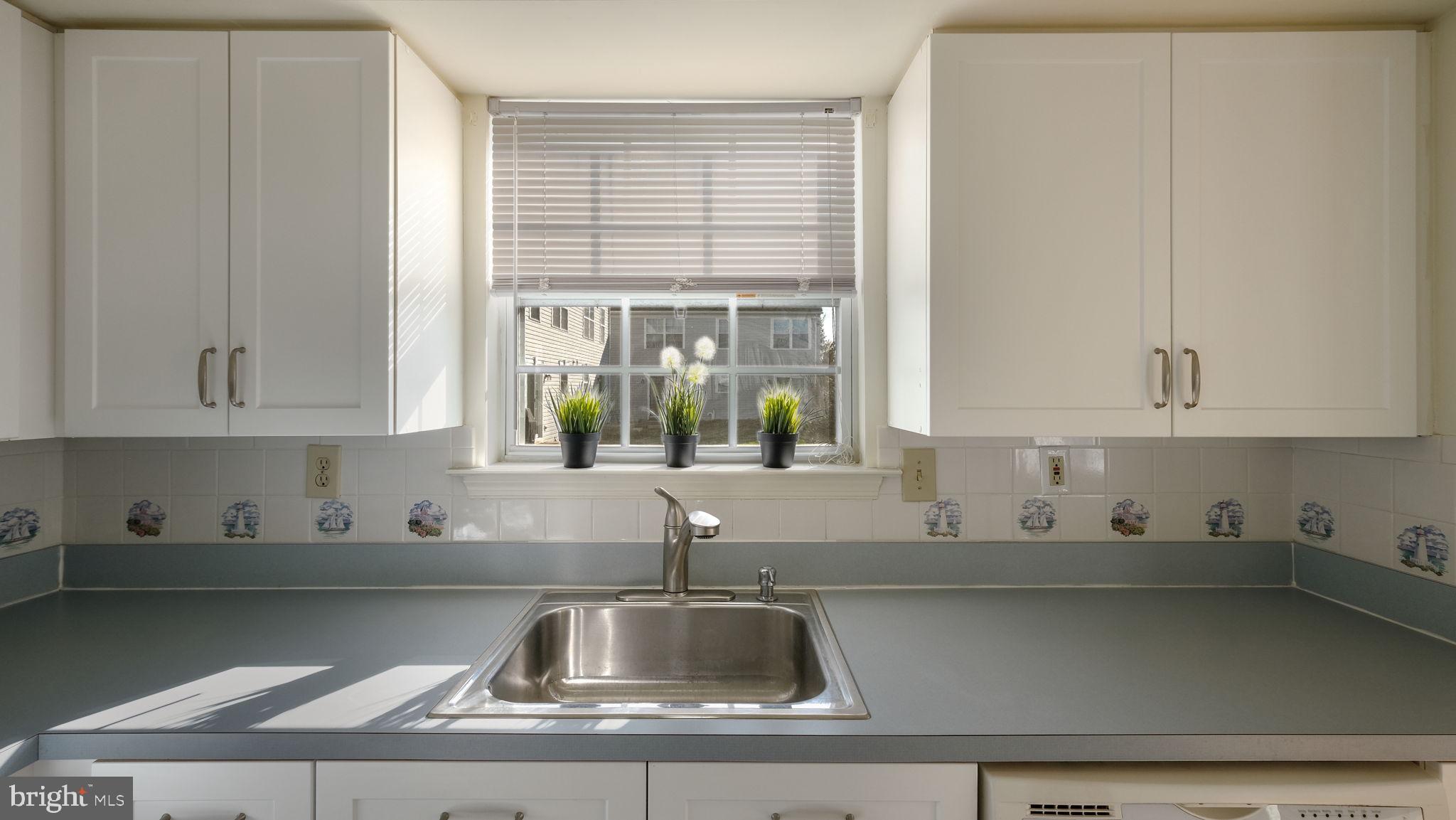 5480 Rinker Circle Doylestown, PA 18902 - Photo 12 of 23 a kitchen with a sink and cabinets