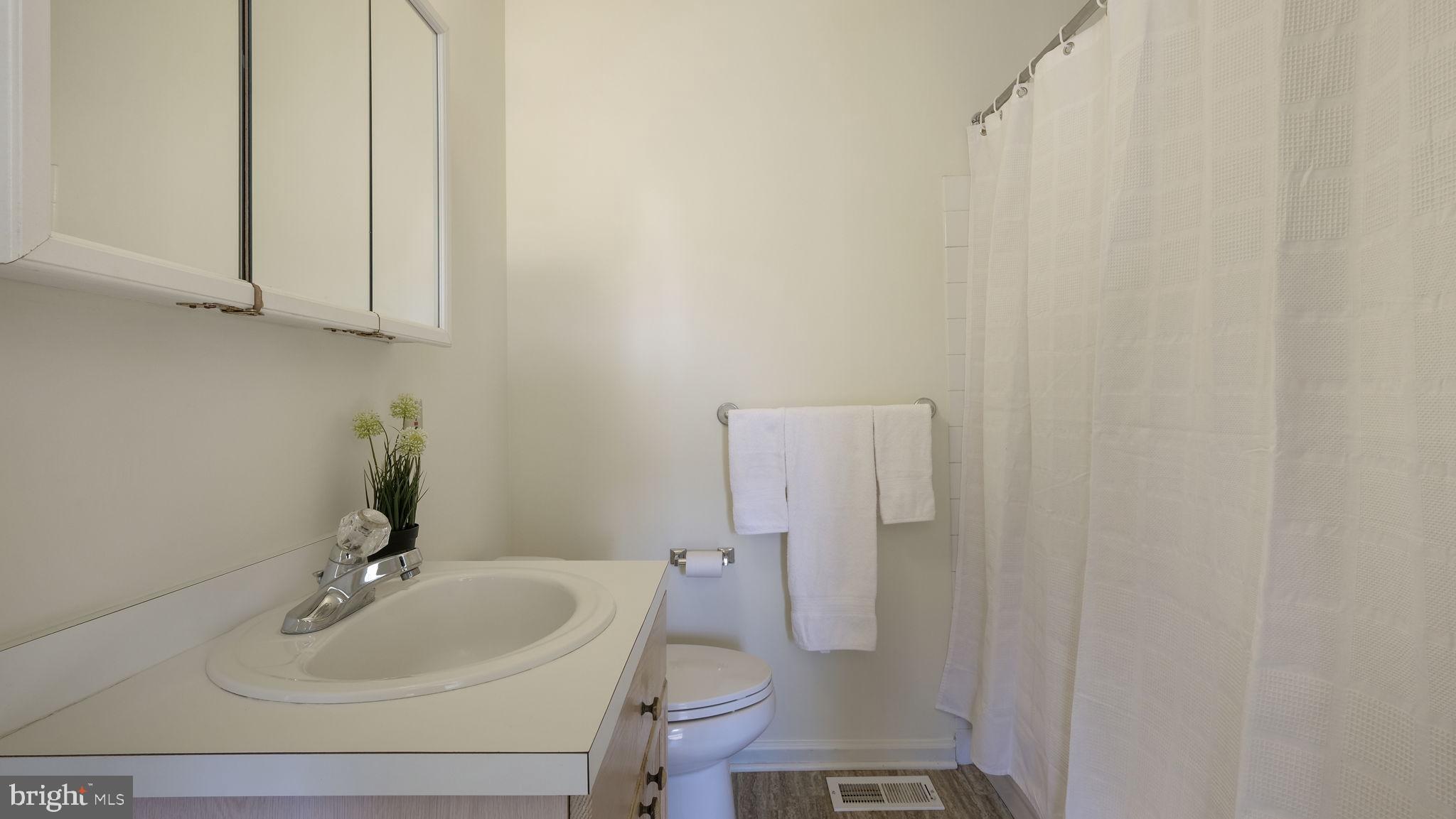 5480 Rinker Circle Doylestown, PA 18902 - Photo 19 of 23 a bathroom with a sink a toilet and a mirror