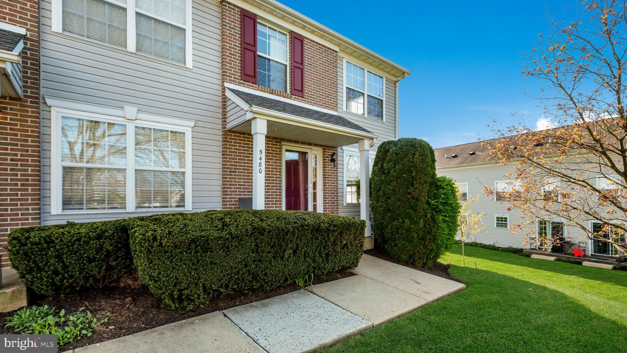 5480 Rinker Circle Doylestown, PA 18902 - Photo 23 of 23 a view of a house with brick walls and a yard with plants