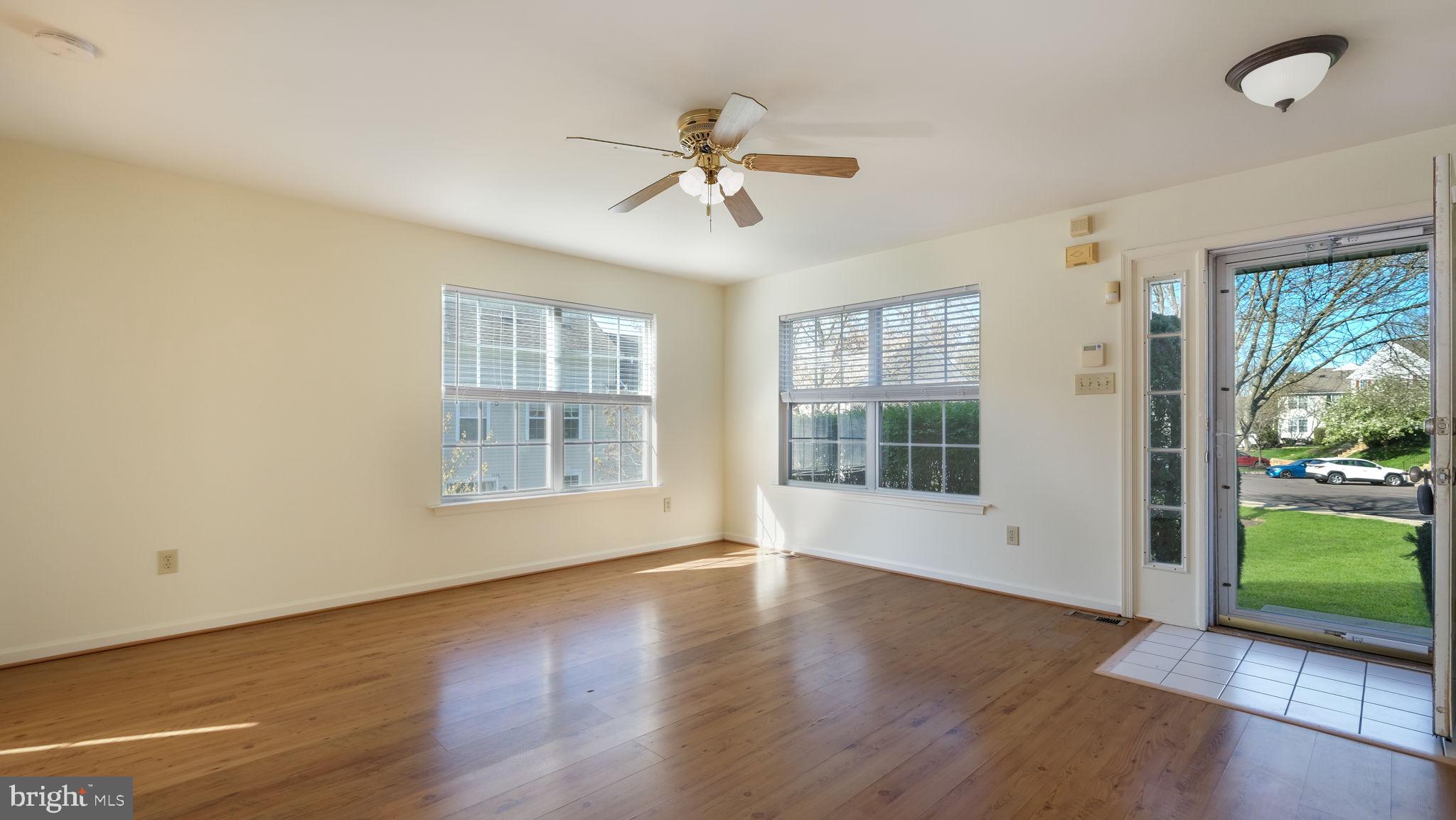5480 Rinker Circle Doylestown, PA 18902 - Photo 5 of 23 a view of an empty room with a window and wooden floor