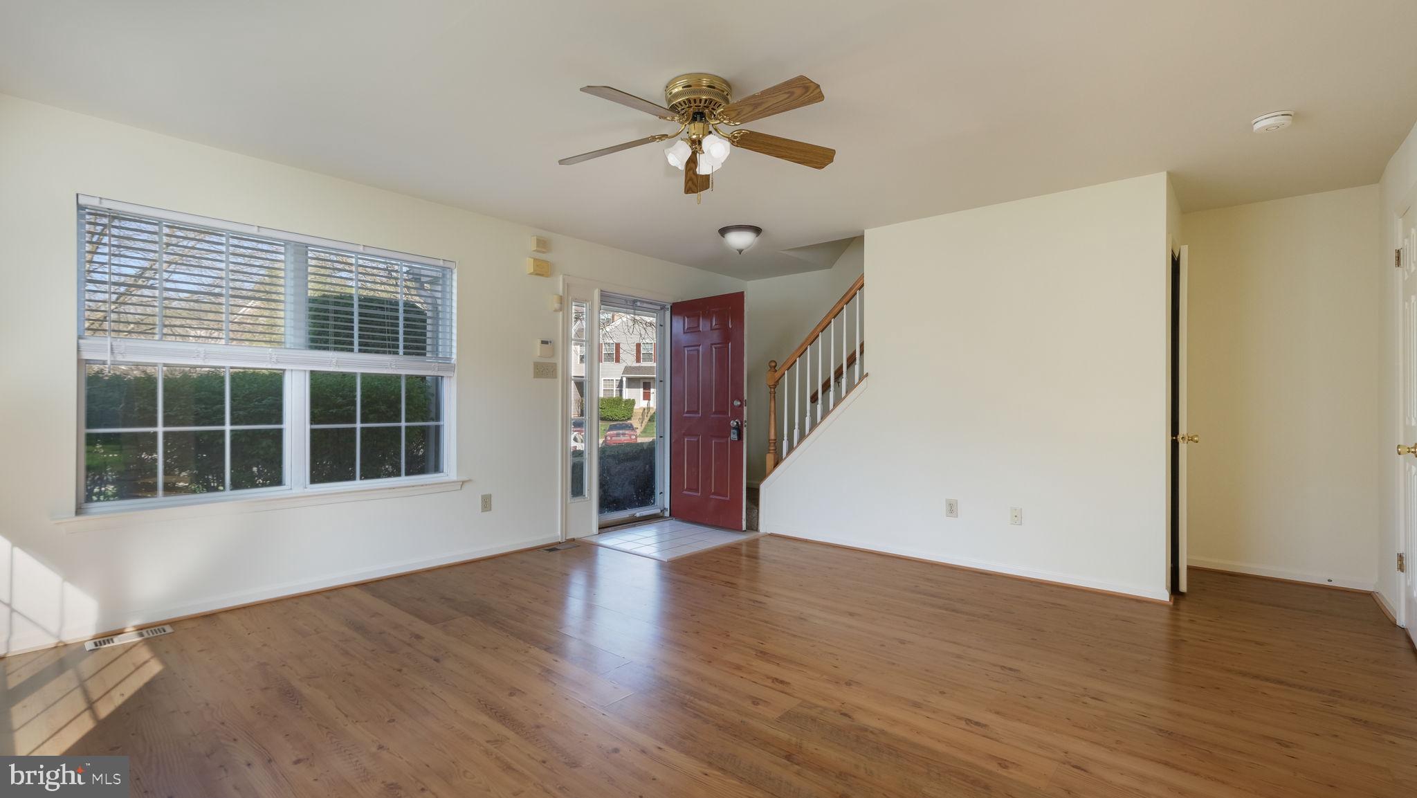 5480 Rinker Circle Doylestown, PA 18902 - Photo 6 of 23 a view of an empty room with wooden floor and a window