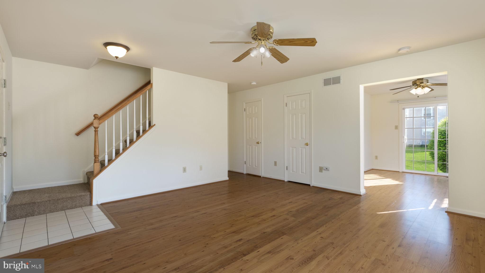 5480 Rinker Circle Doylestown, PA 18902 - Photo 7 of 23 a view of an empty room with wooden floor and a ceiling fan