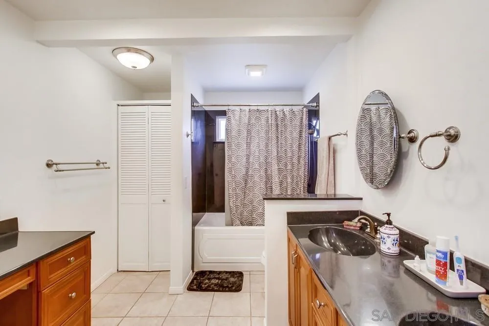 14759 Alando Place Poway, CA 92064 - Photo 18 of 30 a bathroom with a sink vanity granite tub shower and mirror