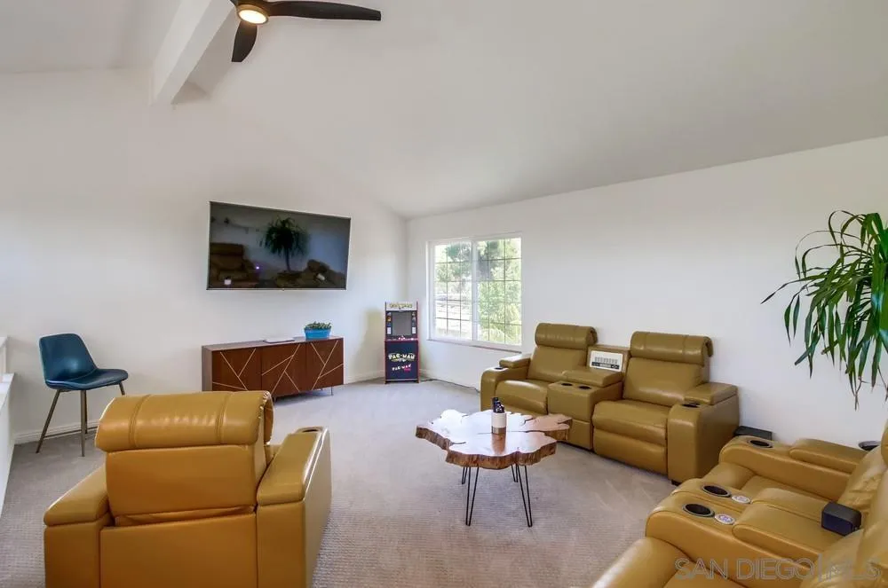 14759 Alando Place Poway, CA 92064 - Photo 21 of 30 a living room with furniture and a flat screen tv