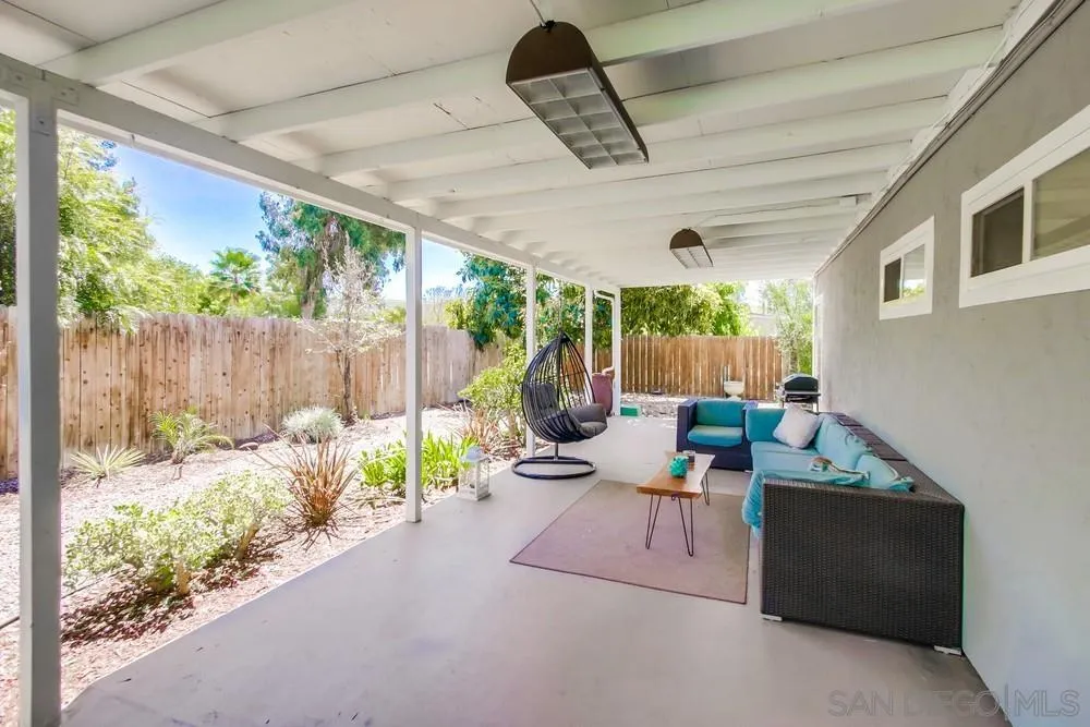 14759 Alando Place Poway, CA 92064 - Photo 24 of 30 a backyard of a house with garden and outdoor seating