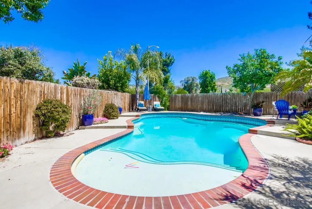 14759 Alando Place Poway, CA 92064 - Photo 28 of 30 a view of a wooden dinning table and chairs in the patio