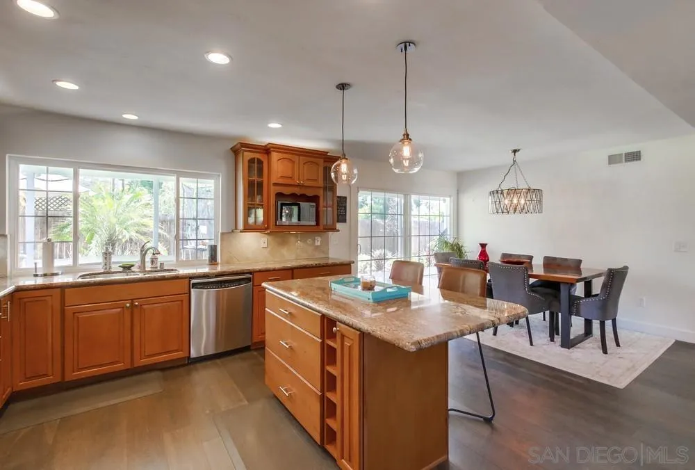 14759 Alando Place Poway, CA 92064 - Photo 8 of 30 a kitchen with stainless steel appliances granite countertop a stove and a sink