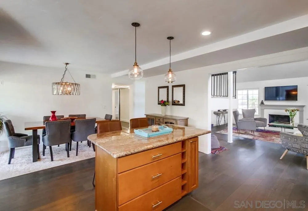 14759 Alando Place Poway, CA 92064 - Photo 9 of 30 a kitchen with a stove center island cabinets and wooden floor