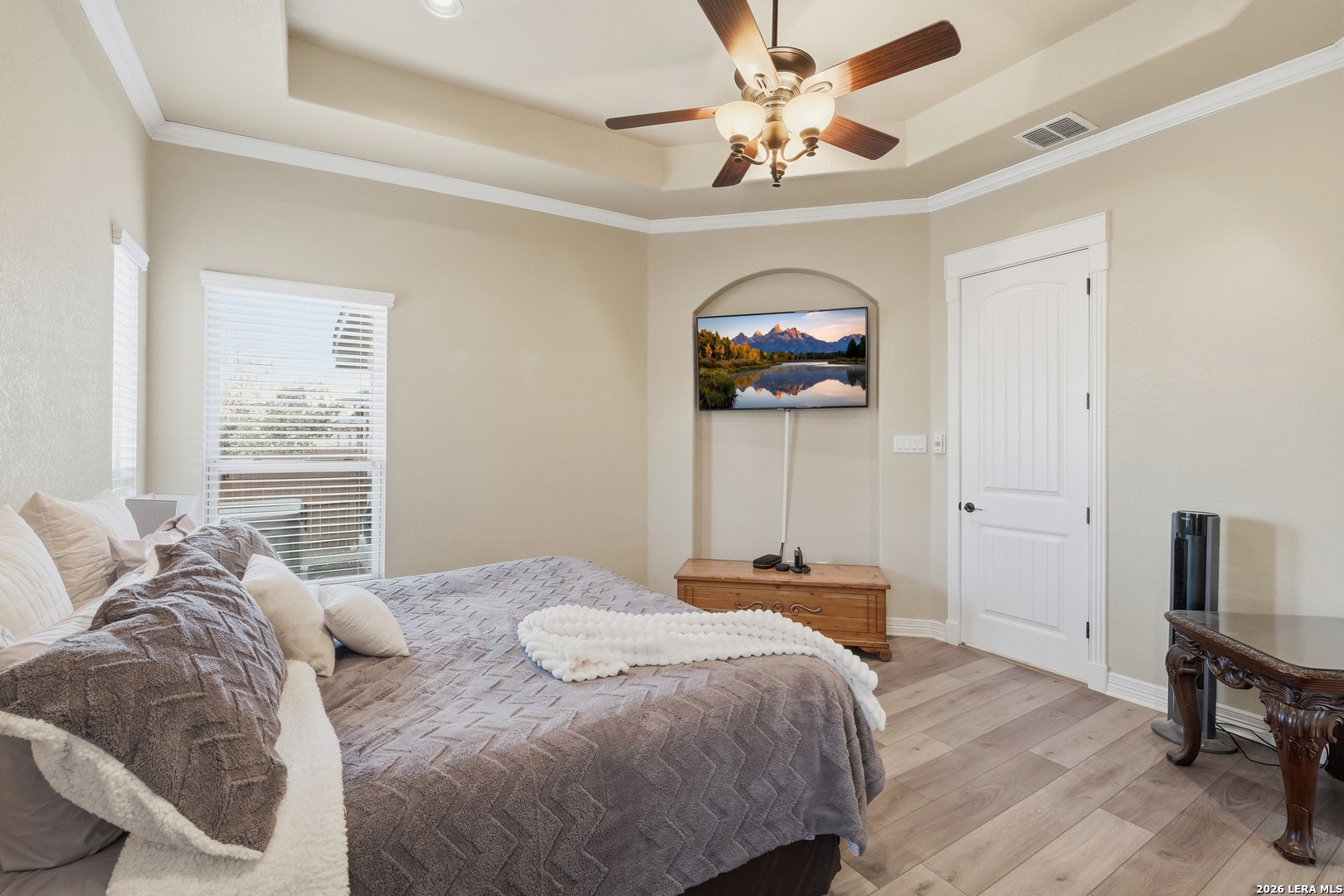 14715 Rifleman Road San Antonio, TX 78254 - Photo 18 of 30 a bedroom with a bed and a chandelier