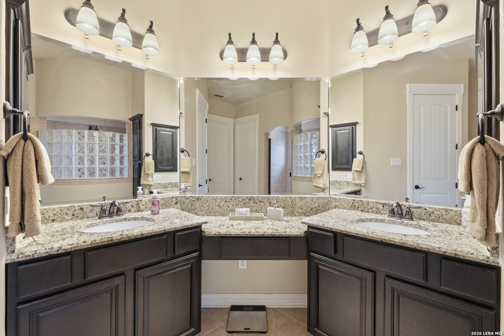 14715 Rifleman Road San Antonio, TX 78254 - Photo 20 of 30 a bathroom with a sink vanity and a mirror