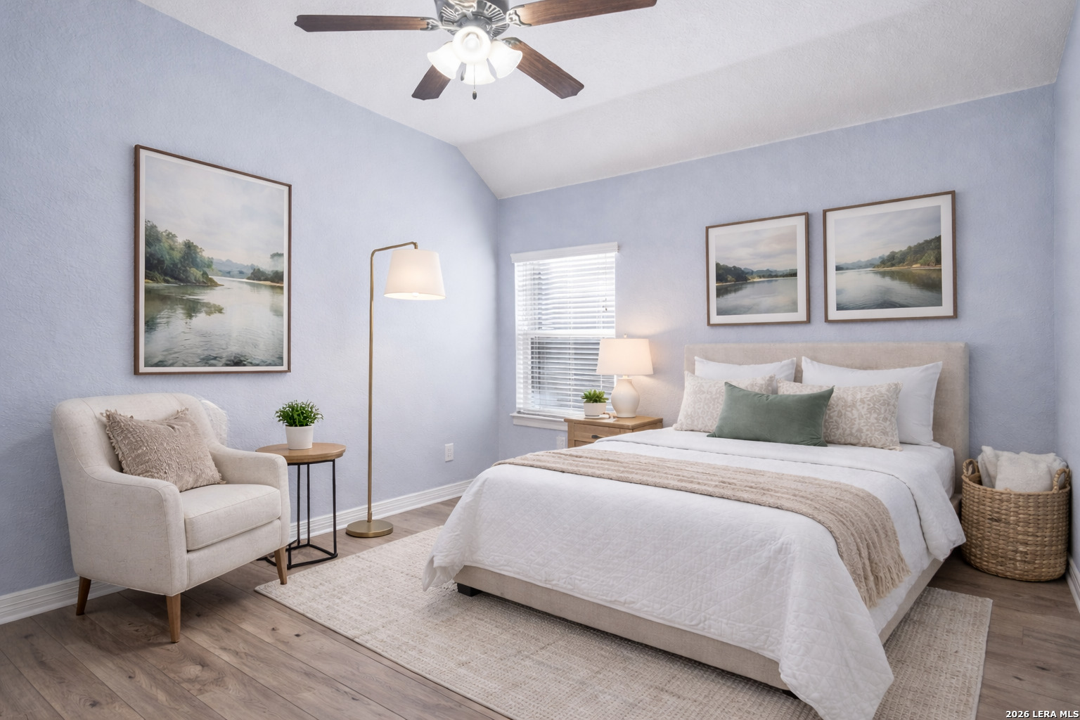 14715 Rifleman Road San Antonio, TX 78254 - Photo 25 of 30 a bedroom with a bed and a chandelier