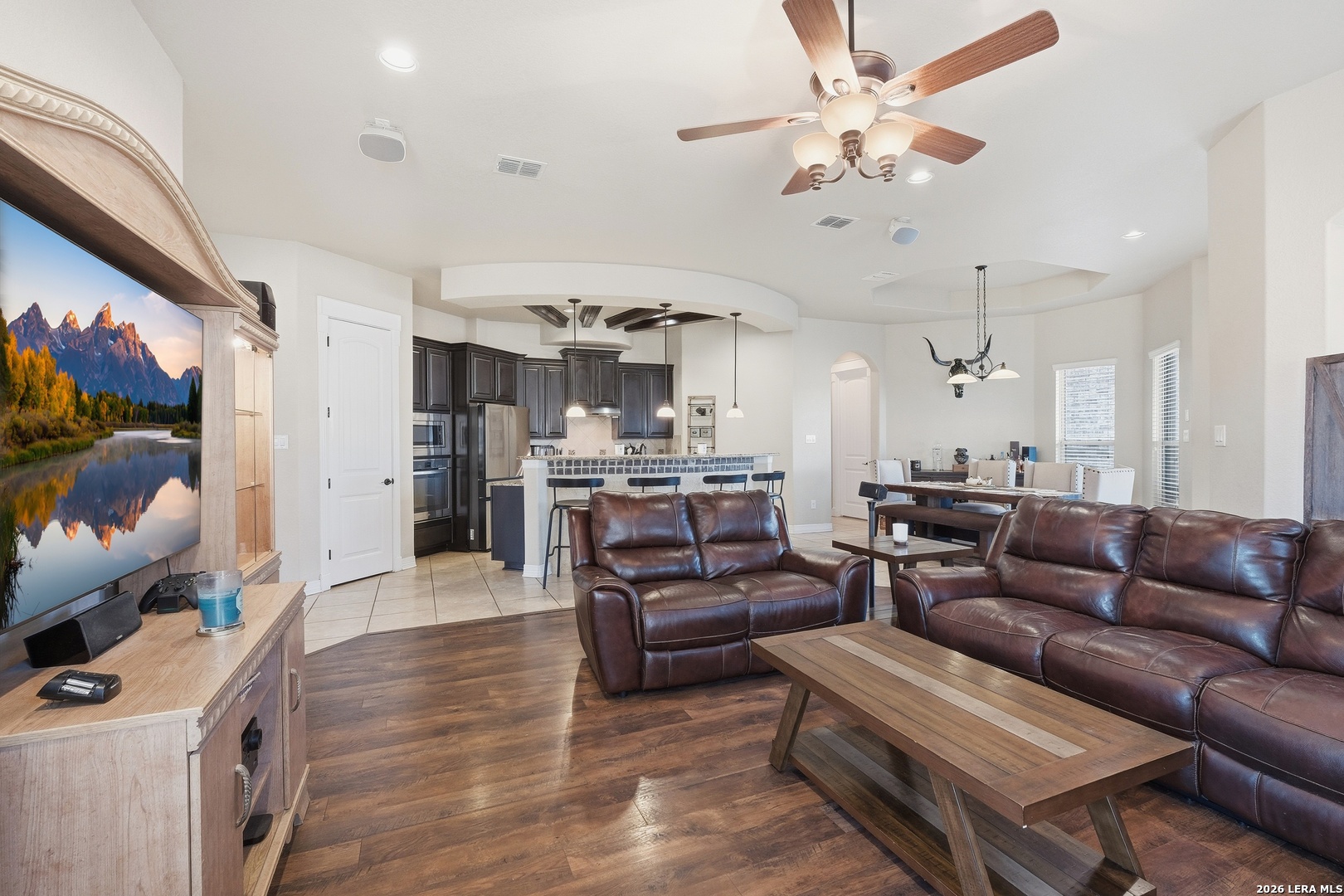 14715 Rifleman Road San Antonio, TX 78254 - Photo 7 of 30 a living room with furniture kitchen view and a chandelier