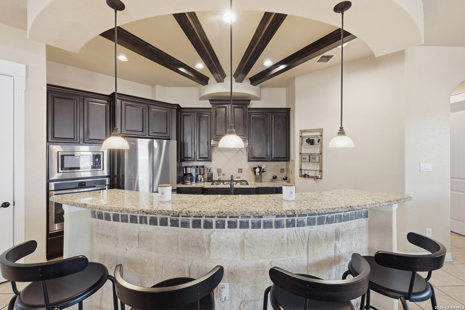 14715 Rifleman Road San Antonio, TX 78254 - Photo 9 of 30 a kitchen with a table and chairs