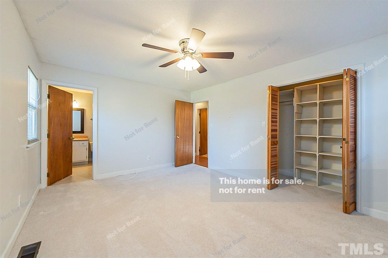 332 Lakeview Road Durham, NC 27712 - Photo 14 of 20 a view of empty room with wooden floor and ceiling fan