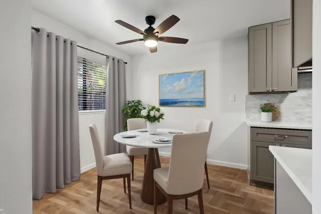 a view of a dining room with furniture window and wooden floor