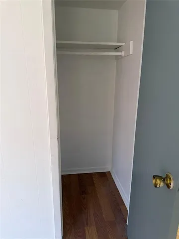 a bathroom with a sink toilet and mirror