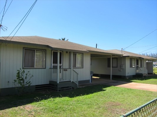 8562 Kekaha Road Kekaha, HI 96752 - Photo 1 of 12 a front view of a house with a yard