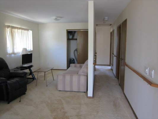8562 Kekaha Road Kekaha, HI 96752 - Photo 11 of 12 a living room with furniture and a flat screen tv