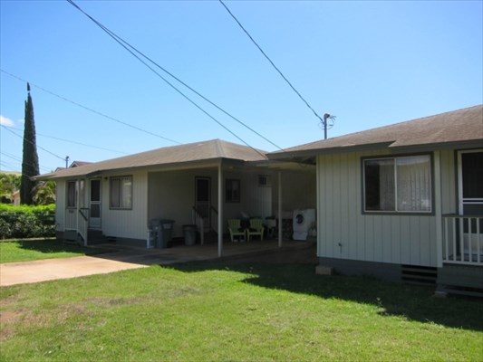 8562 Kekaha Road Kekaha, HI 96752 - Photo 2 of 12 a view of a house with backyard and porch