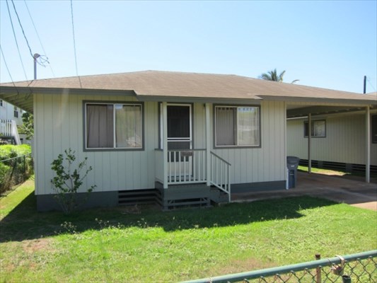 8562 Kekaha Road Kekaha, HI 96752 - Photo 3 of 12 a front view of a house with a yard