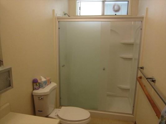 8562 Kekaha Road Kekaha, HI 96752 - Photo 8 of 12 a white toilet sitting next to a bathroom sink