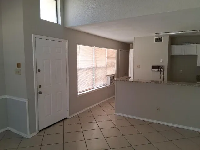 a kitchen with a sink a stove and cabinets