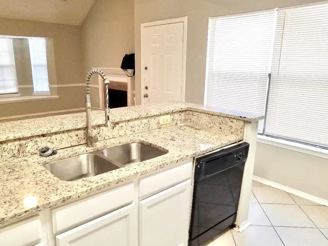 a view of a hallway with entryway door