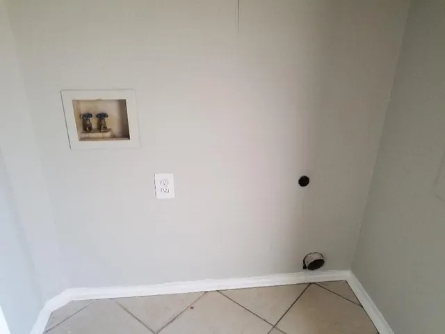 a white toilet sitting next to a bath tub