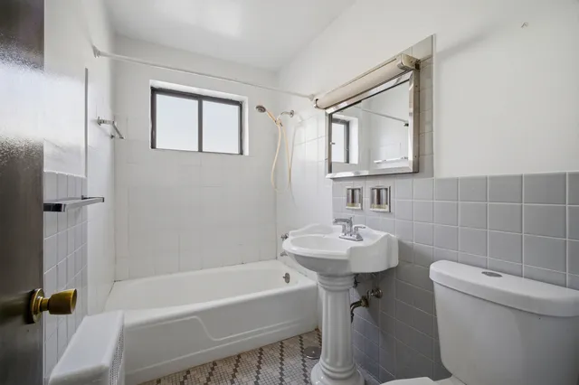 a bathroom with a sink toilet and bathtub