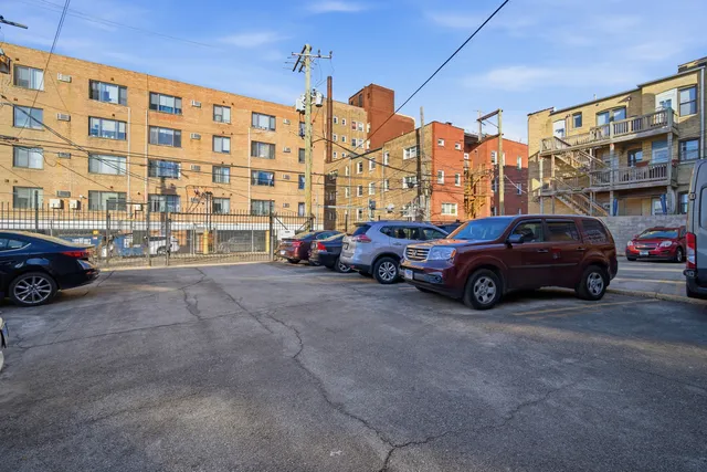 a view of a cars parked in front of a building