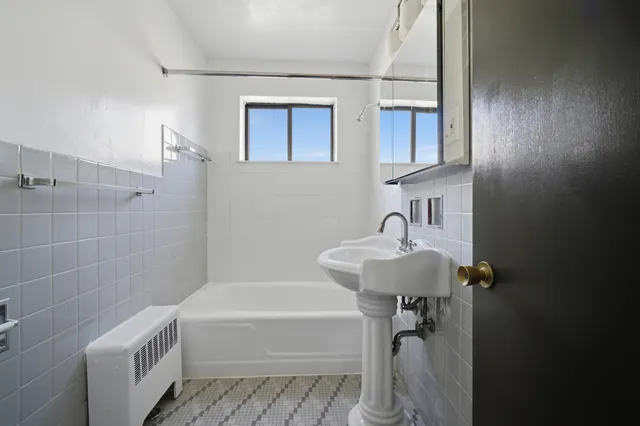 a bathroom with a sink a bathtub and a shower