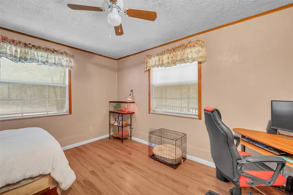 a bedroom with furniture and a window