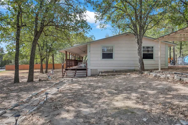 a house with trees in front of it