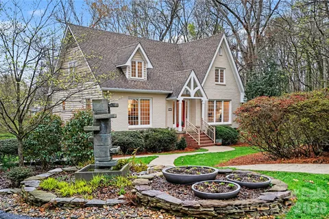 a view of a house with garden and plants