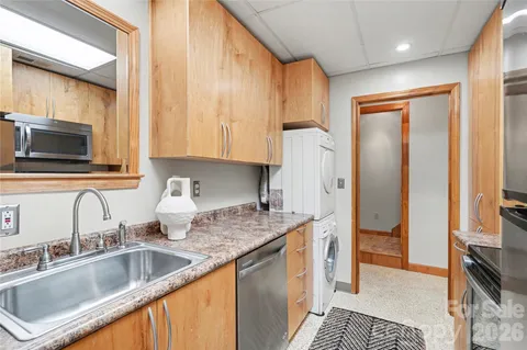 a view of a two chairs in the balcony