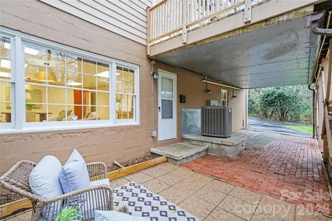 a view of a white house with a yard and garage