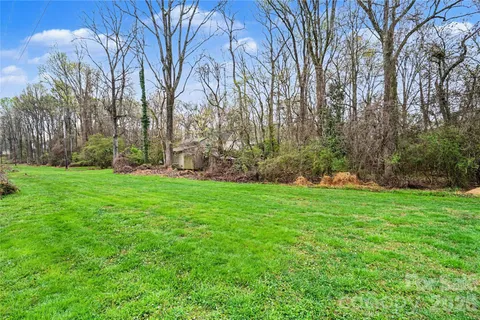 a view of a city with lush green forest