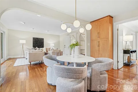 a living room with fireplace furniture and a flat screen tv