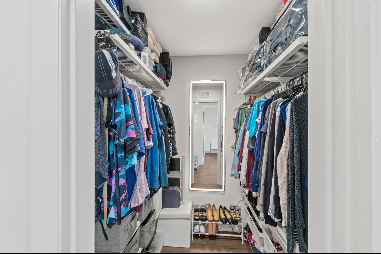 5500 Northwest 2nd Avenue, Unit 414 Boca Raton, FL 33487 - Photo 17 of 38 a view of walk in closet with clothes