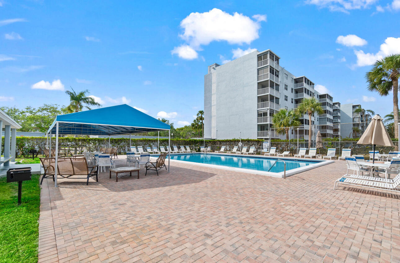 5500 Northwest 2nd Avenue, Unit 414 Boca Raton, FL 33487 - Photo 31 of 38 a view of a building with sitting area and furniture