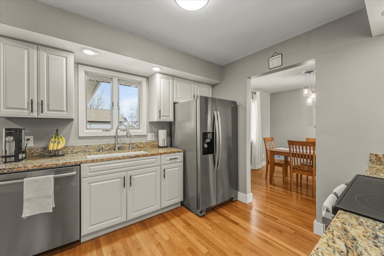 2608 Rachel Road Champaign, IL 61822 - Photo 11 of 47 a kitchen with stainless steel appliances granite countertop a refrigerator sink and cabinets